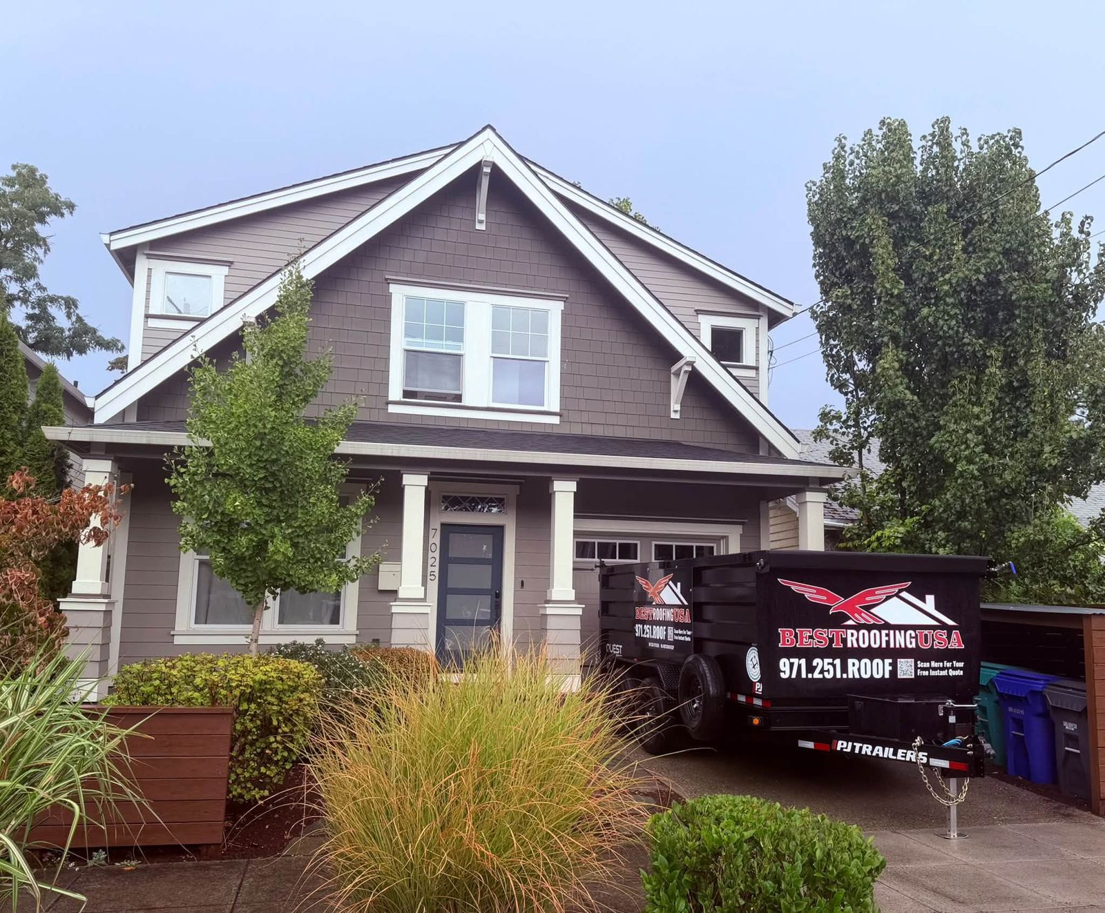 Craftsman home with the Best Roofing USA trailer in the driveway